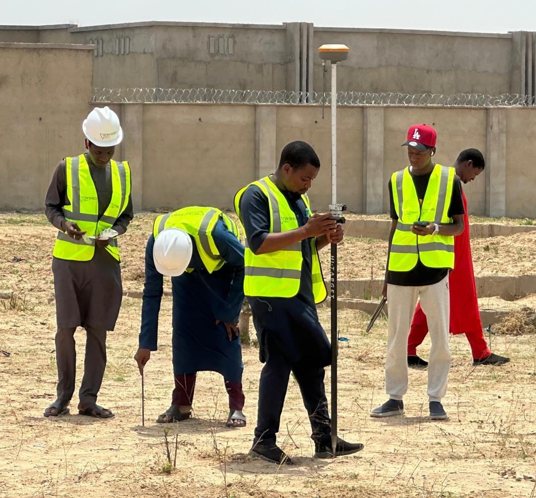 Viewshed site team setting out levels on a Katsina project